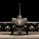 The F-16V/Block 70. Note conformal fuel tanks on upper fuselage. The aircraft is also equipped with a centerline fuel tank, twelve satellite guided bombs, two AIM-120 AMRAAM radar-guided air to air missiles, and two AIM-9X Sidewinder missiles.